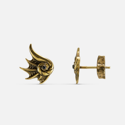 Gold Abyss Conch Ear Studs with curled conch form, black zircon center, fin-like ridges, and flat back post on a clean background.