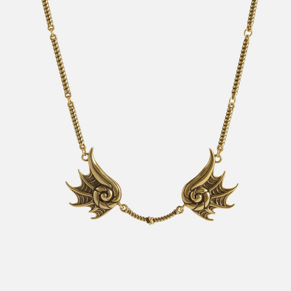 Gold Abyssal Bind Necklace with twin conch-like forms, shell ridges, central rope chain detail, and antiqued finish on a clean background.