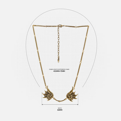 Size guide image for the gold Abyssal Bind Necklace, showing the necklace length, chain drop, and twin shell-like centerpiece measurements.