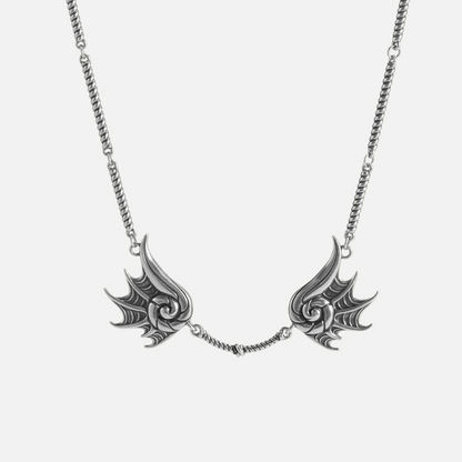 Silver Abyssal Bind Necklace with twin conch-like forms, shell ridges, central rope chain detail, and antiqued finish on a clean background.