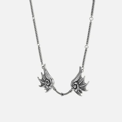 Silver Abyssal Bind Necklace with twin shell-like side pieces, central rope chain detail, and antiqued gothic finish on a clean background.