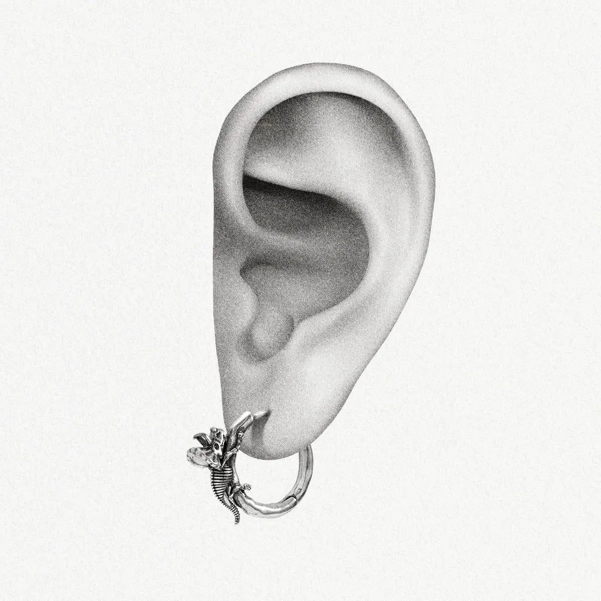 Silver Adaptive Evolution hoop earring shown on an ear illustration