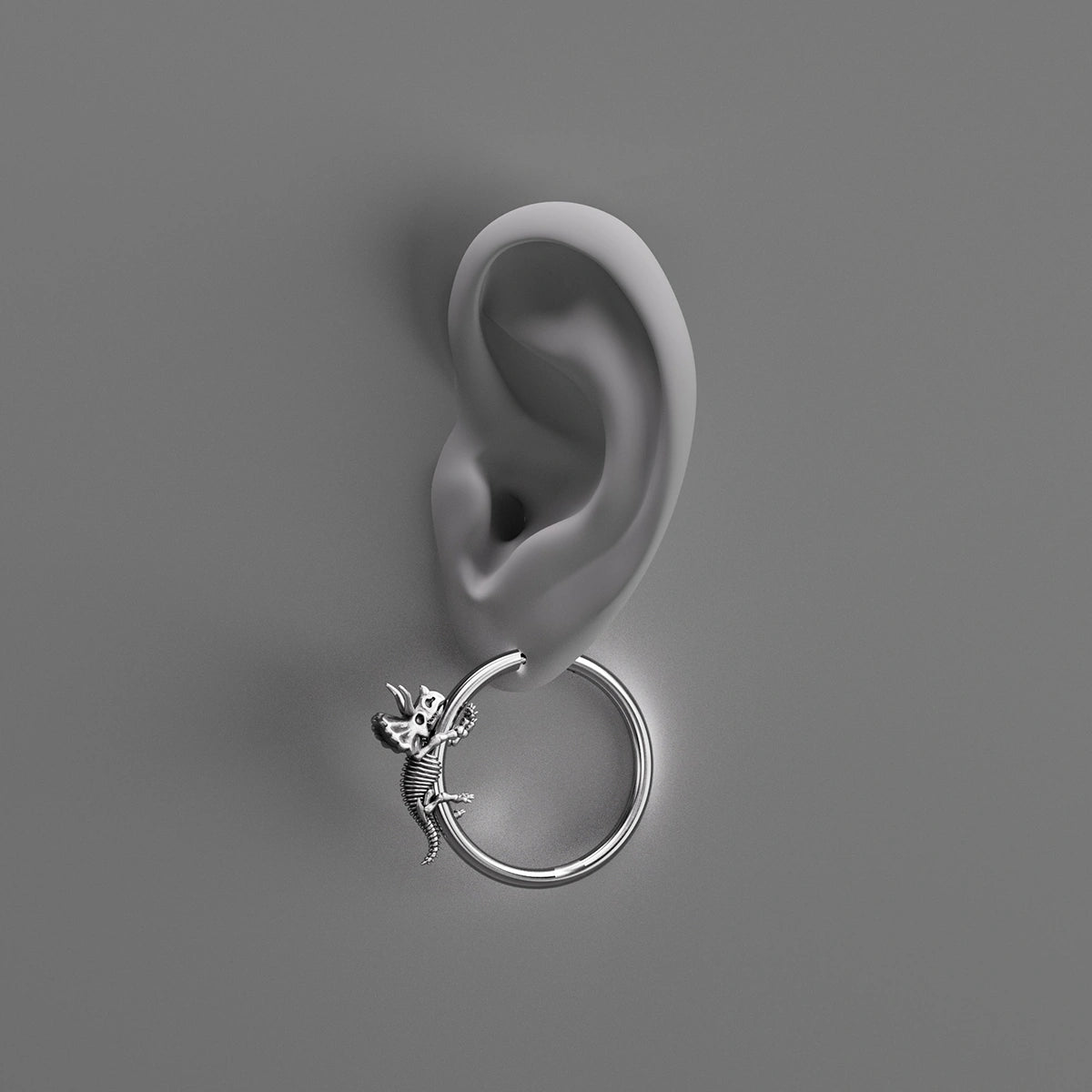 Silver Adaptive Evolution hoop earring shown on an ear illustration