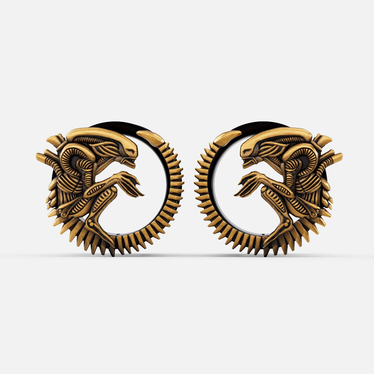 Pair of gold Alien Invasion tunnels with curled biomechanical creature design