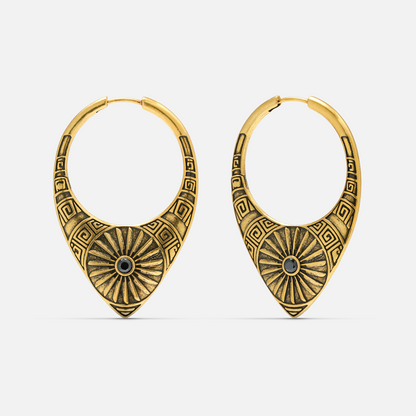 Pair of antique gold-tone hoop earrings featuring a sunburst medallion and geometric etched pattern