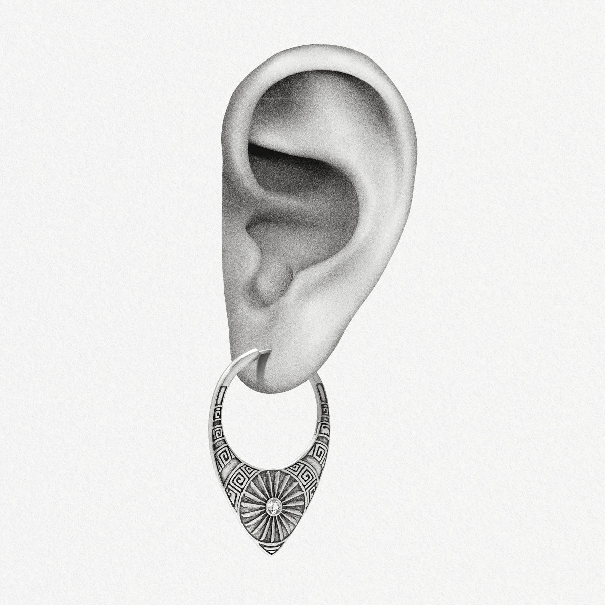Silver Ancient Sun hoop earring shown on an ear illustration