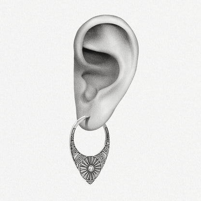 Silver Ancient Sun hoop earring shown on an ear illustration