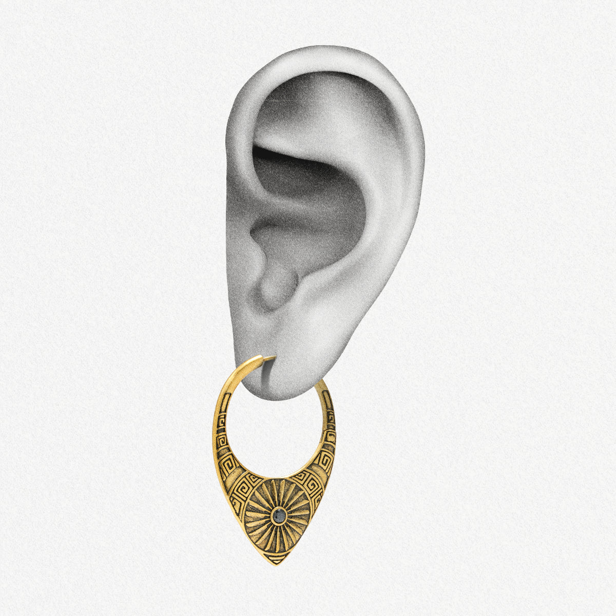 Gold Ancient Sun hoop earring shown on an ear illustration