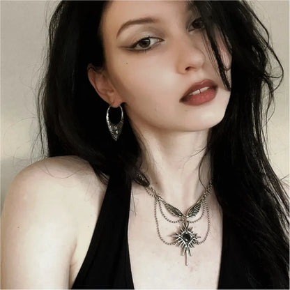 Silver Ancient Sun Earrings styled on model with geometric sunburst pattern and antique celestial jewelry look
