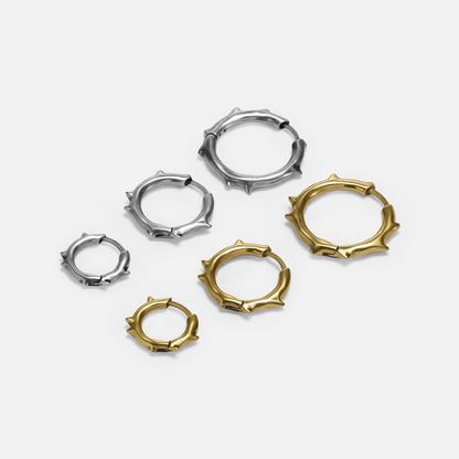 Ancient Thorn Hoops shown in silver and gold tones with multiple hoop size options
