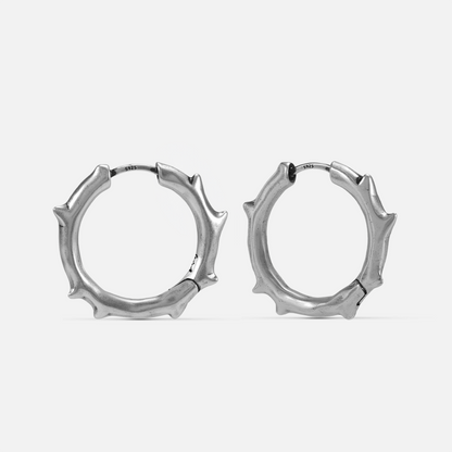Ancient Thorn Hoops in silver-tone brass with protective thorn silhouette
