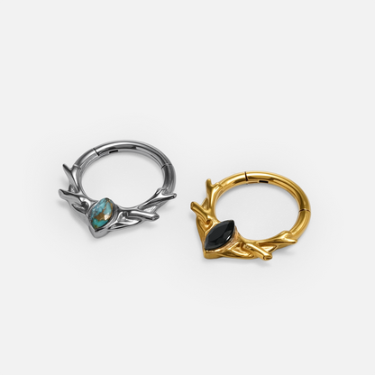 Antler Mark Clicker shown in polished titanium and 18K gold PVD with turquoise and obsidian options