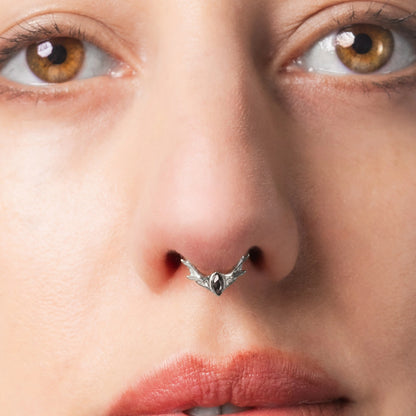 Close-up of model wearing silver Antler Mark Clicker with black obsidian center stone