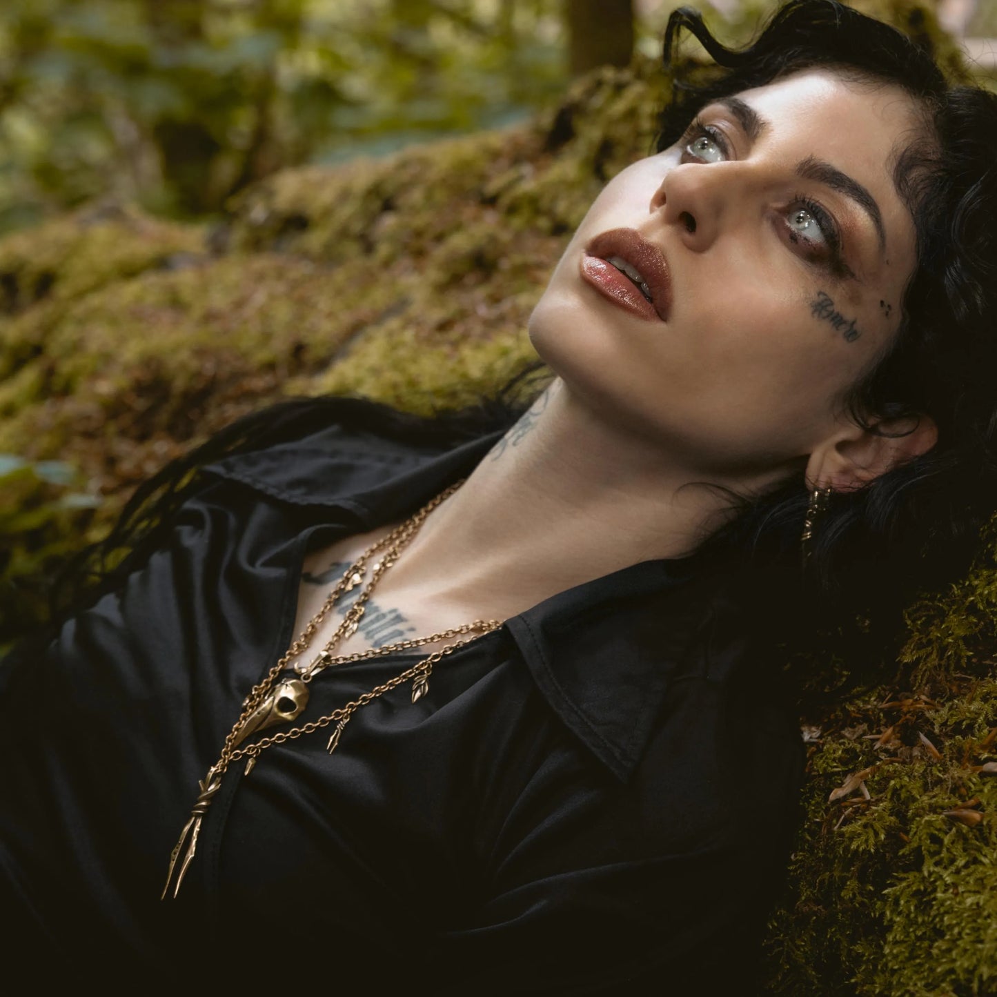 Augur Skull Necklace worn by model in dark forest setting with woodland relic styling