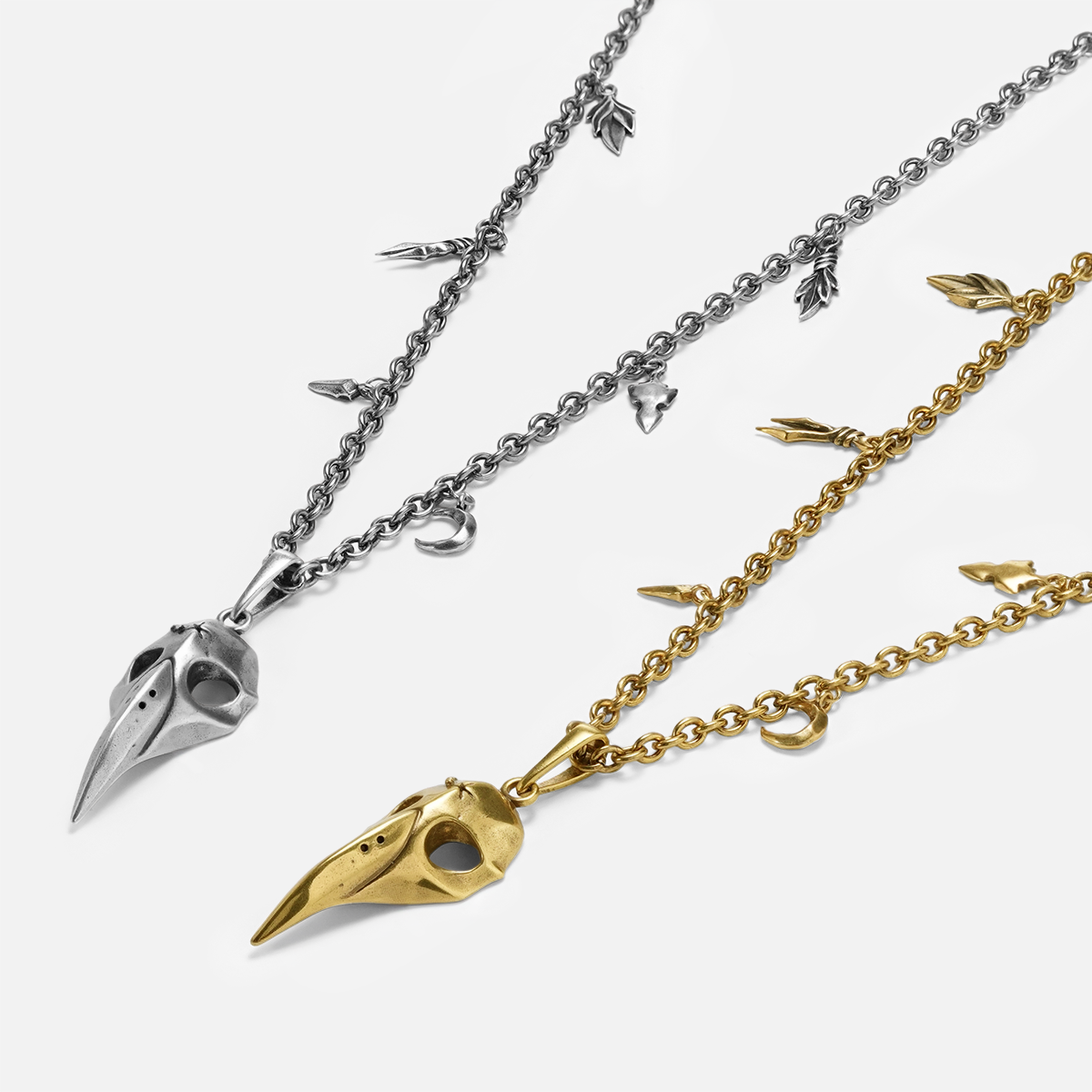 Augur Skull Necklace shown in silver and 18K gold plating with antiqued bird skull pendant