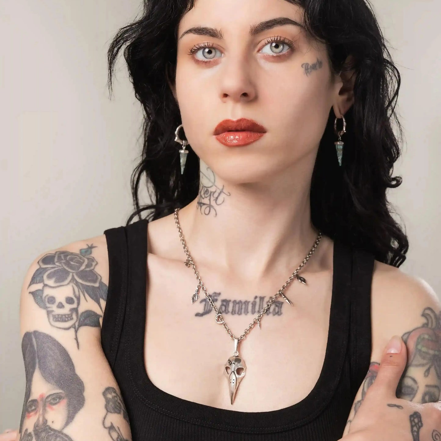 Silver Augur Skull Necklace styled on model with gothic bird skull pendant design
