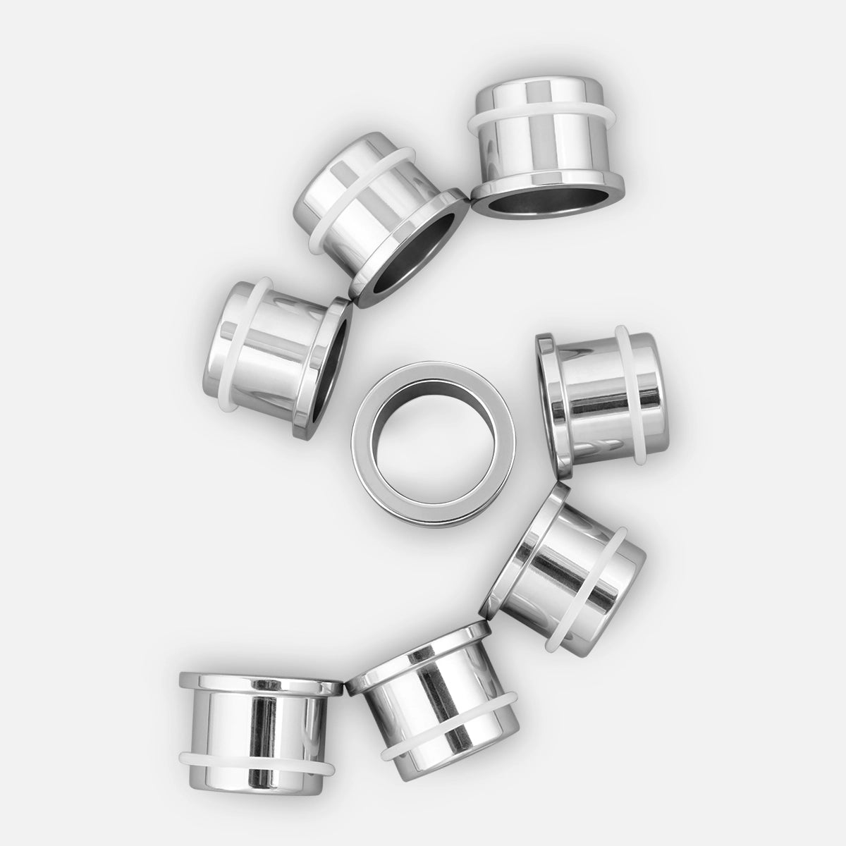 Silver-tone Aurora steel ear stretching kit with five pairs of flared tunnel plugs