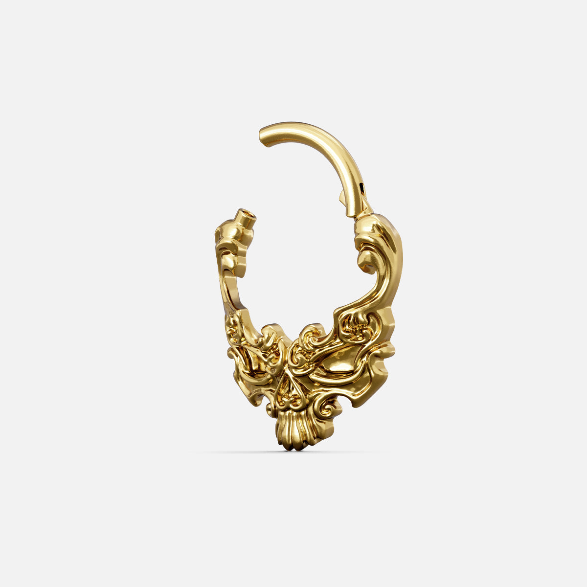 Gold-tone Baroque Skull Clicker shown open with a hinged closure and ornate vintage-inspired details.
