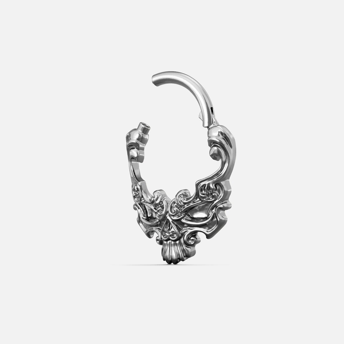 Silver-tone Baroque Skull Clicker shown open to display the hinged closure and sculpted skull details.