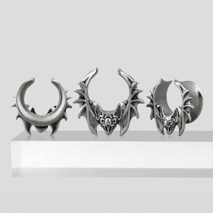 Three sizes of silver Bat Whisper tunnels displayed on a white pedestal