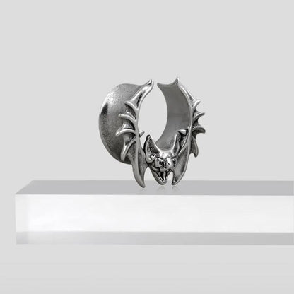 Single large silver Bat Whisper tunnel displayed on a white pedestal