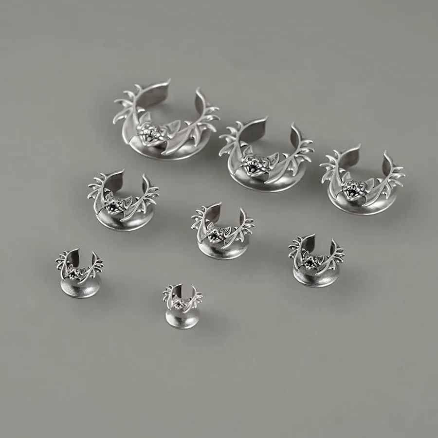 Silver Bat Whisper tunnels in graduated sizes arranged on a white surface