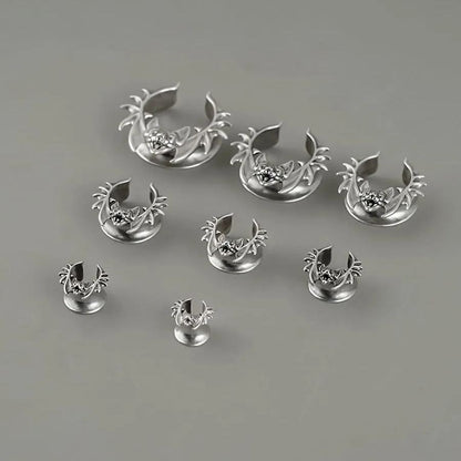 Silver Bat Whisper tunnels in graduated sizes arranged on a white surface