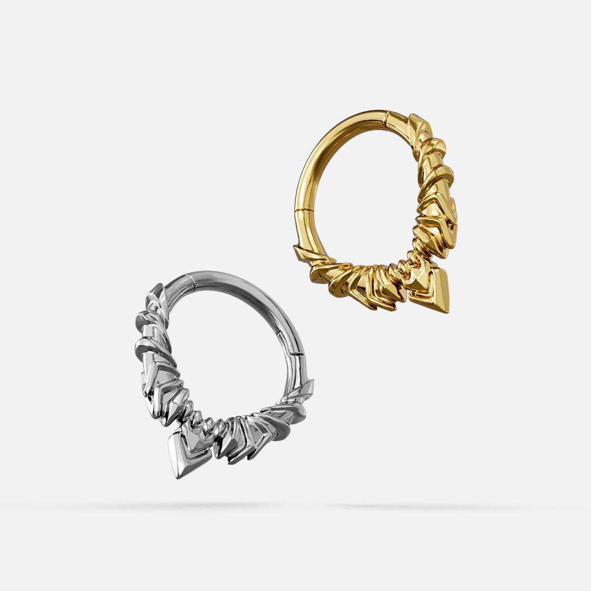 Silver- and gold-tone Bat Wing Clickers displayed together from angled views to show the sculpted wing details.