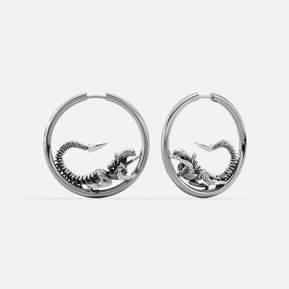 Silver-tone Biomechanical Alien hoop earrings with curled skeletal creature details