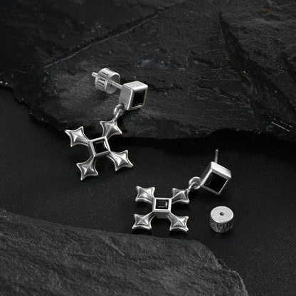 Silver Black Testament Earrings displayed as a pair on black textured fabric.
