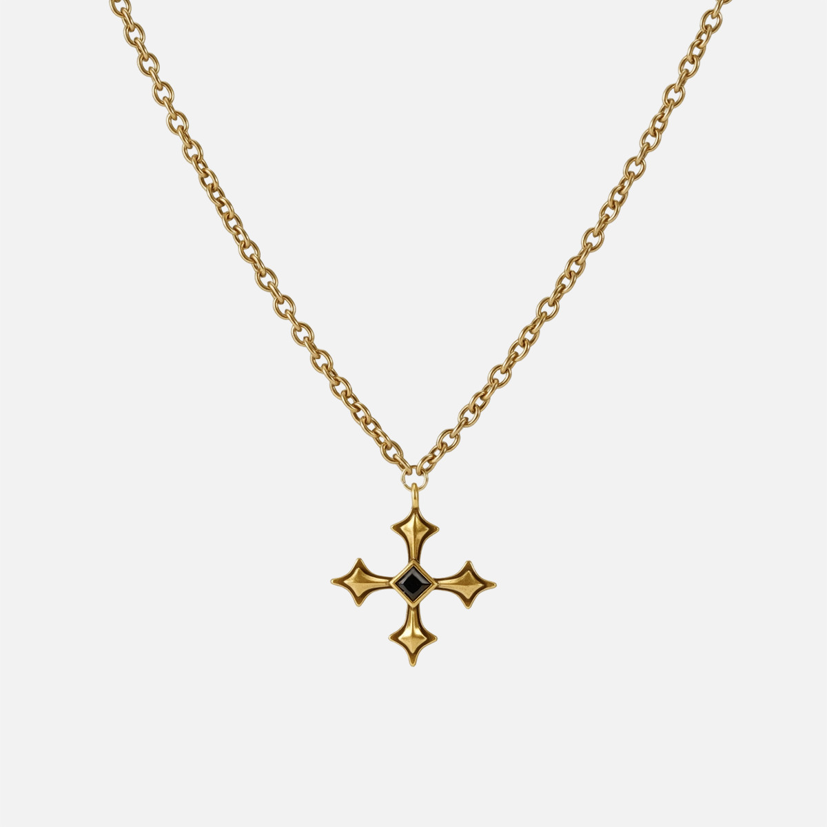 Black Testament Necklace in antiqued 18K gold with a gothic cross pendant and black obsidian, shown full length on white.