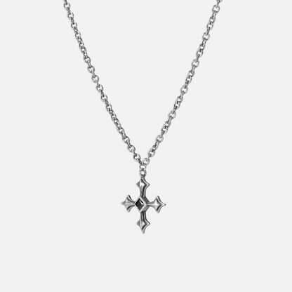 Black Testament Necklace in silver shown vertically on white, highlighting the gothic cross pendant and chain.