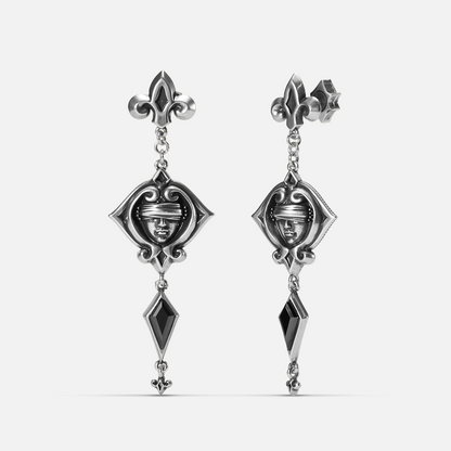 Antiqued silver-tone Blind Oracle Drop Earrings shown from front and side views with blindfolded face motifs and faceted black zircon drops.