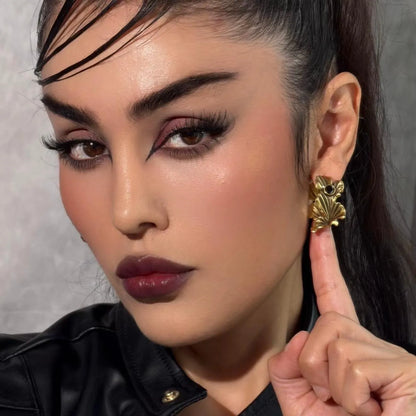 Gold Botanical Ginkgo Earrings styled on model with sculpted ginkgo leaves and nature-inspired gothic jewelry look