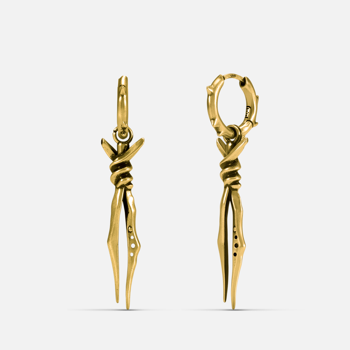 Gold-tone Bound Twin Earrings feature long twin spike drops and an antiqued finish.