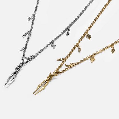 Bound Twin Necklace shown in silver and gold tones with bound twin spike pendant design
