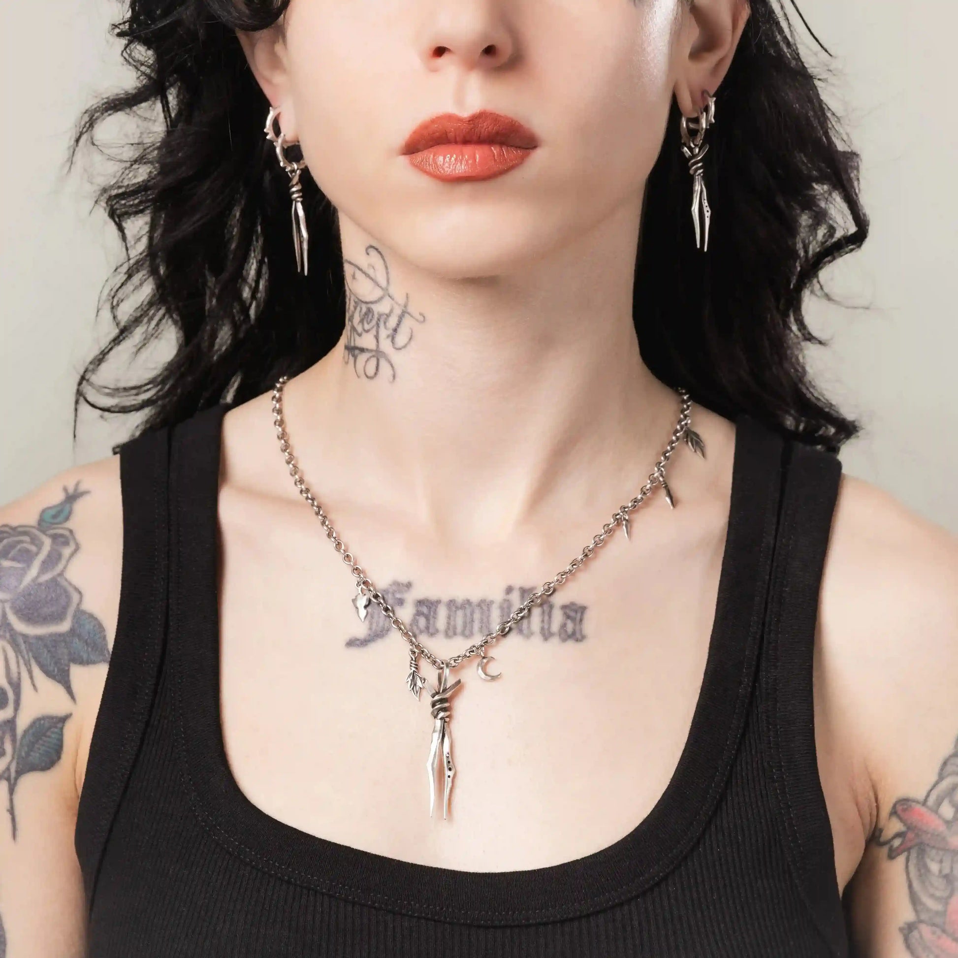 Silver Bound Twin Necklace styled on model with bound spike pendant and gothic jewelry design