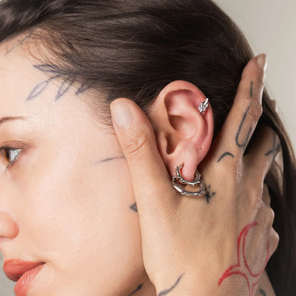 Silver Bramble Leaf Ear Studs styled on ear with woodland inspired piercing jewelry