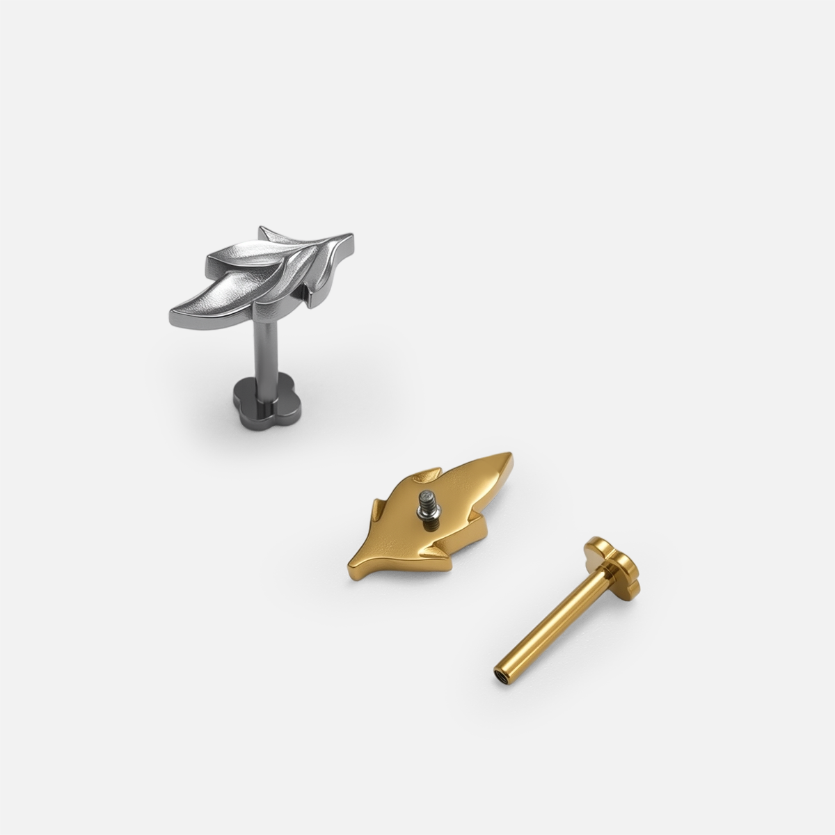 Bramble Leaf Ear Studs shown in polished titanium and 18K gold PVD finish