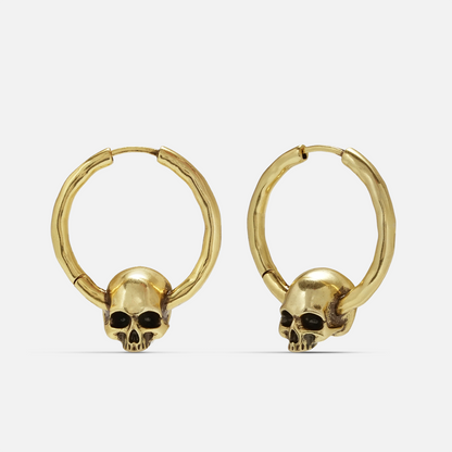 Brave skull earrings in gold, shown as a pair in a front view with skull charm details