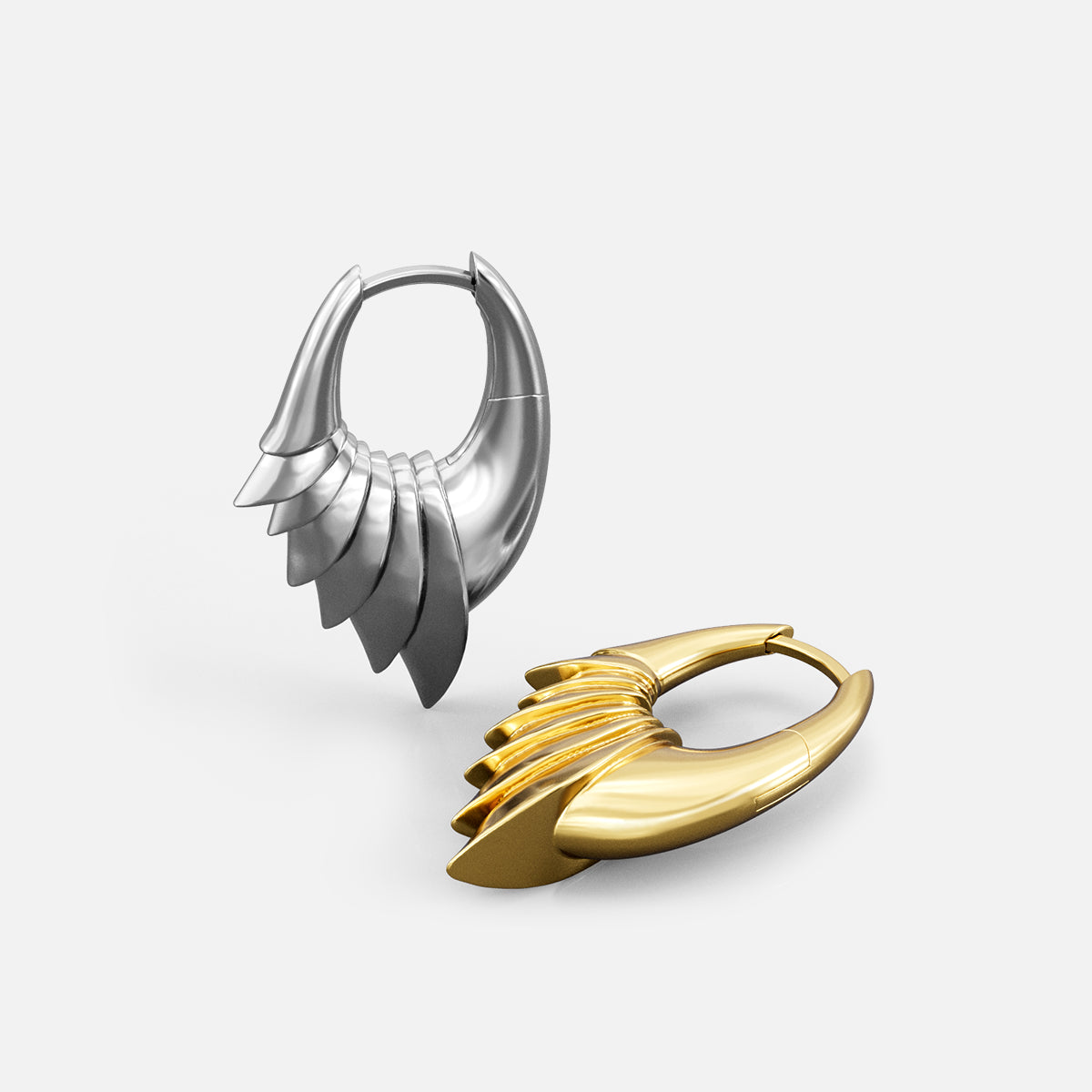 Silver and gold Carapace Wing hoop earrings with layered wing panels