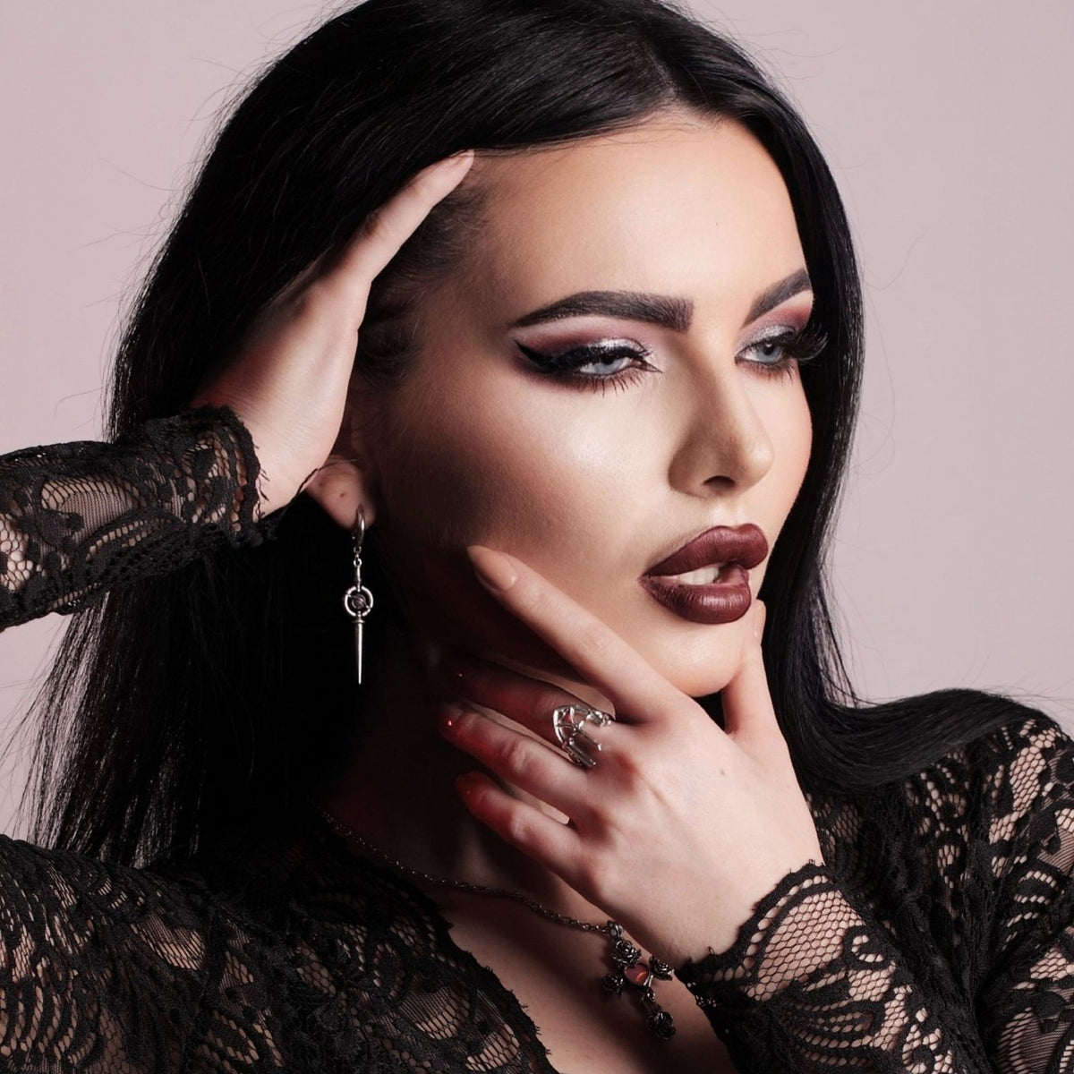Celestial Orbit Earrings in 925 sterling silver, worn in a studio portrait with long black hair, black lace, and dramatic got