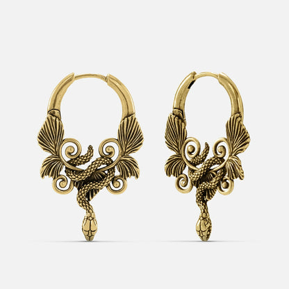 Pair of antique gold-tone hoop earrings featuring a coiled serpent and wing design, front view