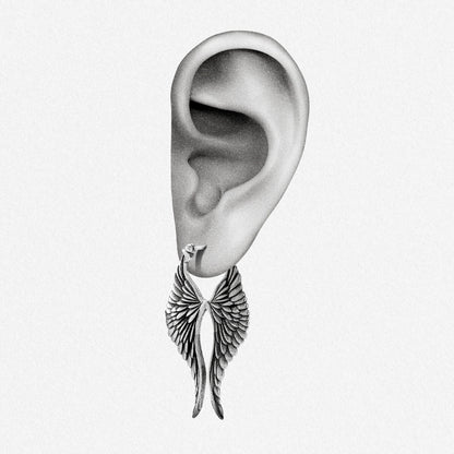 Silver Celestial Wing earring shown on an ear illustration
