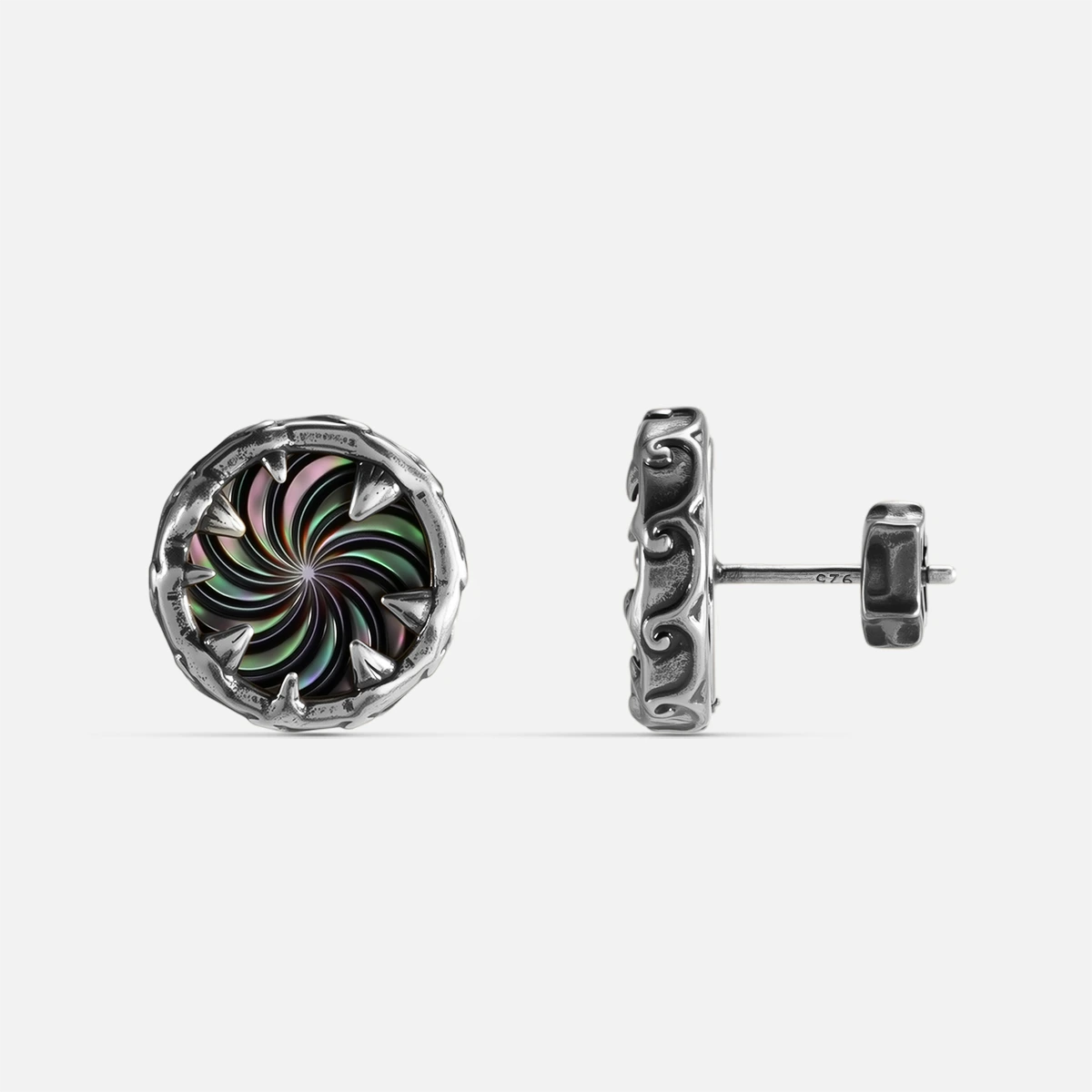 Silver Charybdis Maw Ear Studs with abalone shell spiral center, tooth-like rim, carved side texture, and flat back post on a clean background.
