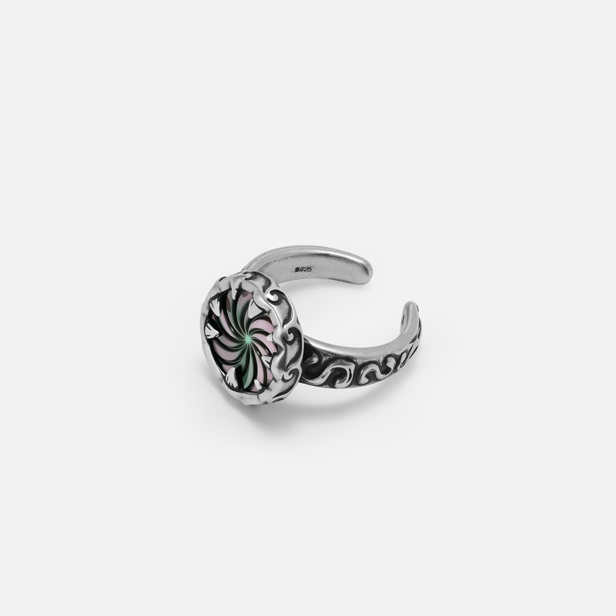 Side view of the Charybdis Maw Ring, showing the open ring design, carved silver band, and abalone shell centerpiece.