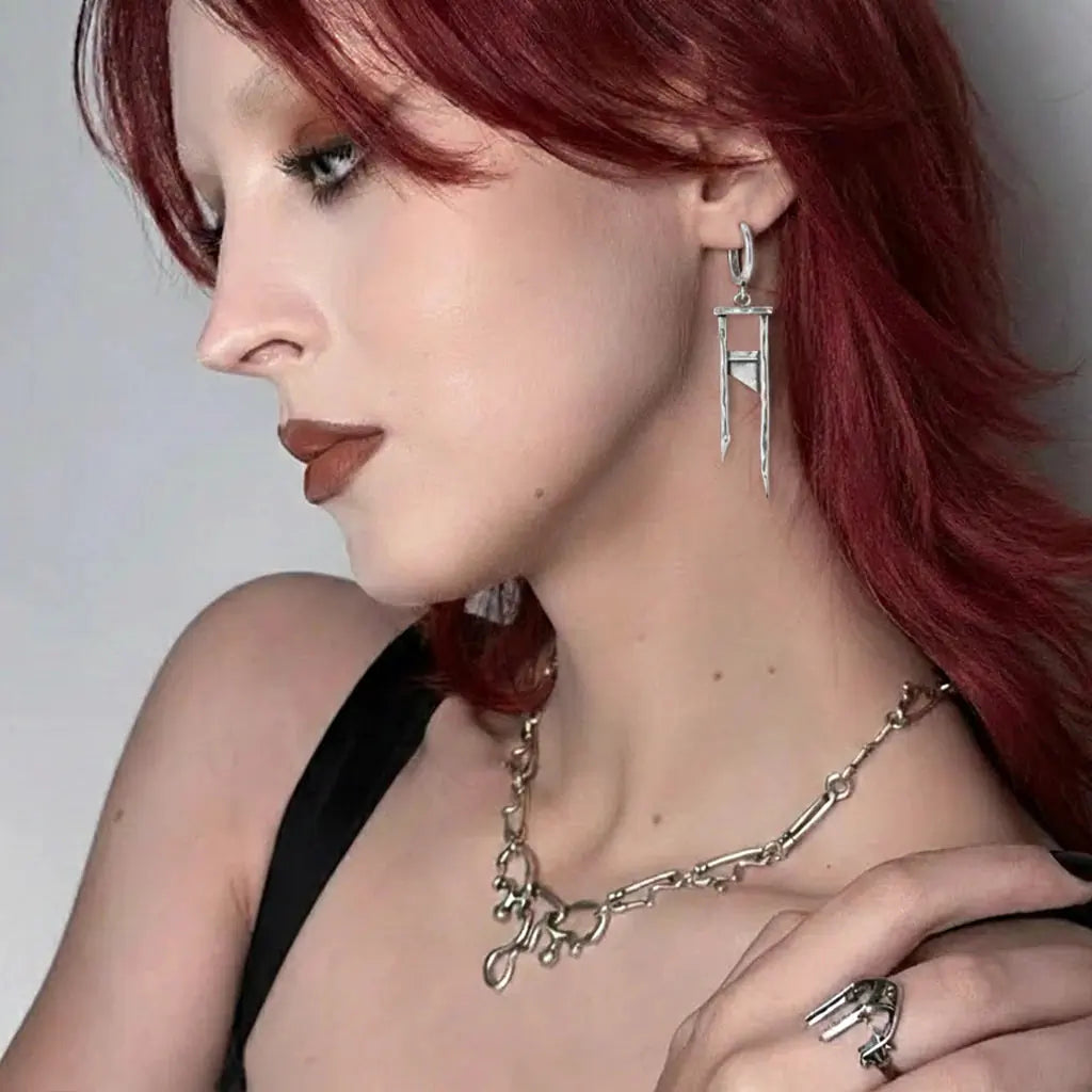 Chic Guillotine Earrings in 925 sterling silver, worn in a red-haired side portrait with a chunky silver chain necklace and h