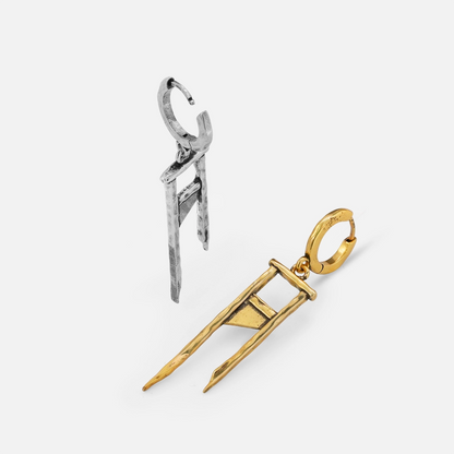 Silver and gold Chic Guillotine hoop earrings shown open and lying flat