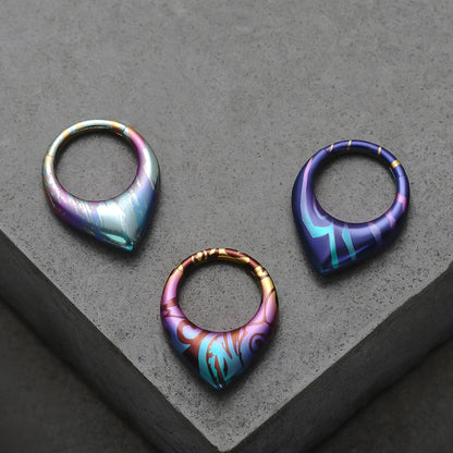 Three color patterns of Chroma Wave titanium clickers displayed on gray blocks