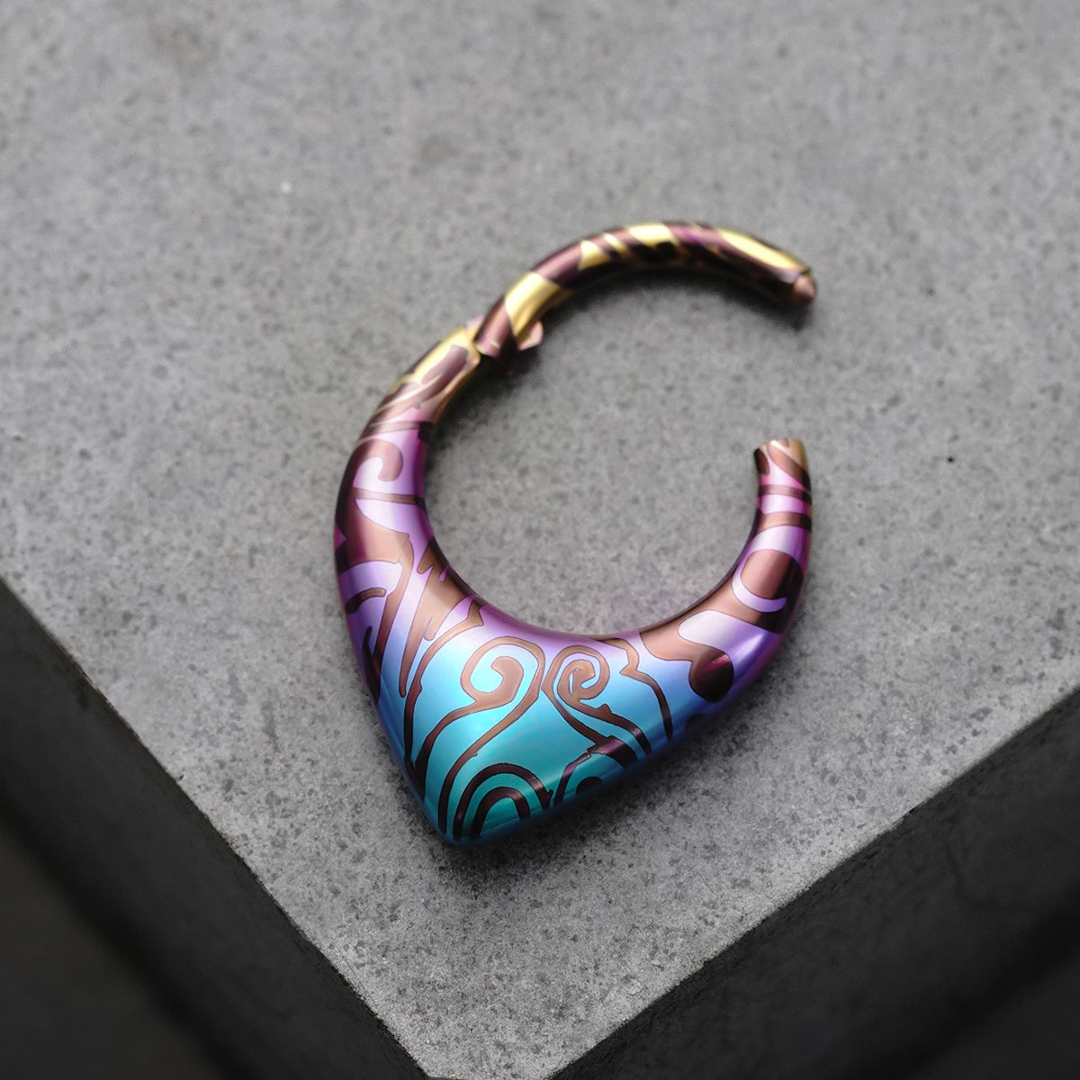 Open Chroma Wave titanium clicker with purple, aqua, and bronze pattern